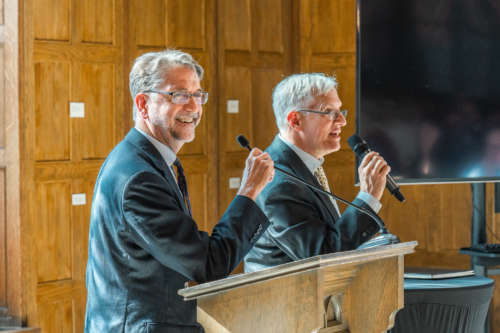 Two professors teach together